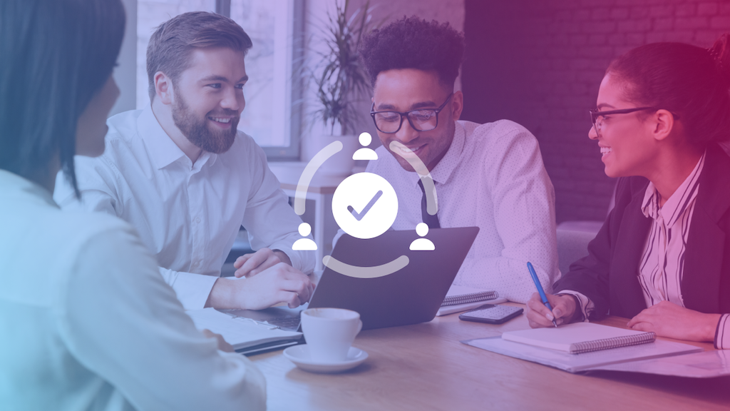 people at conference table with success icon