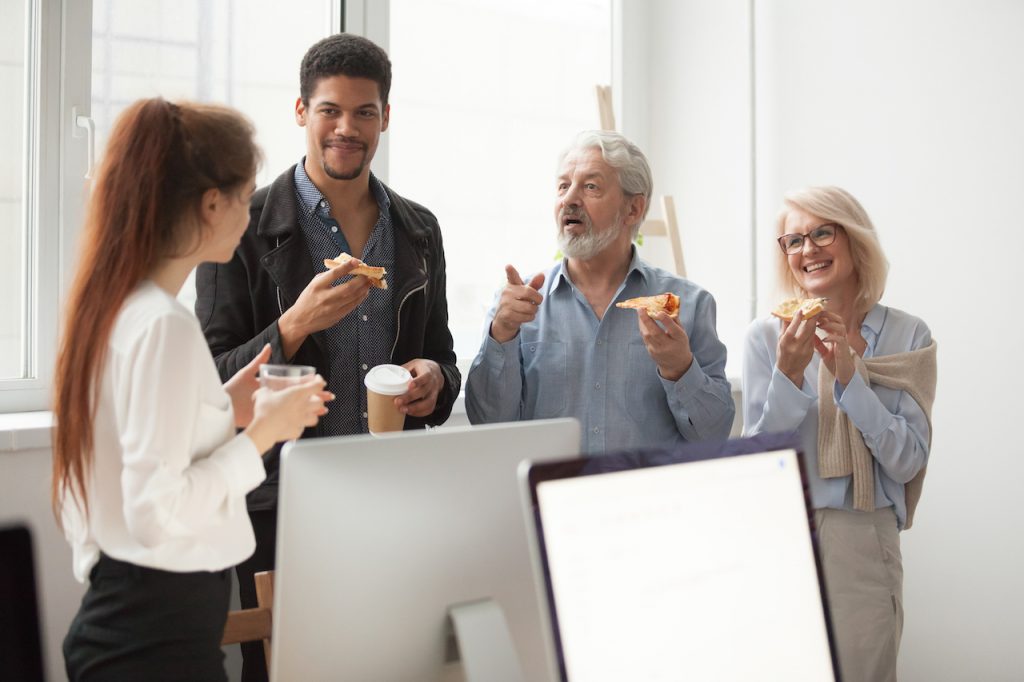 Colleagues talking around coffee | Claromentis