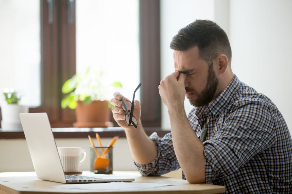 stressed-man-working-with-laptop