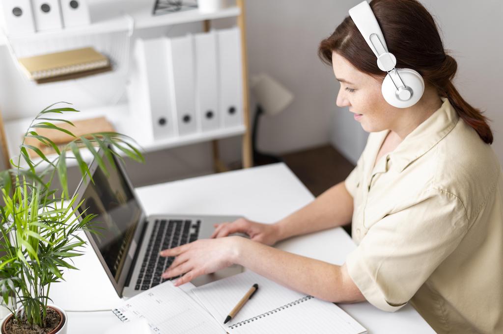 portrait-woman-work-having-video-call-laptop