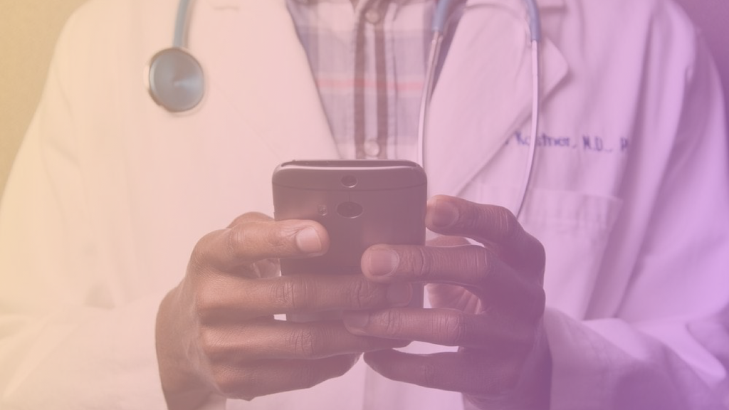 Image of a healthcare professional using his phone