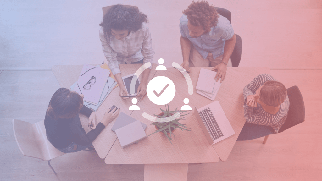 aerial shot of 4 people around a table and collaboration working icon